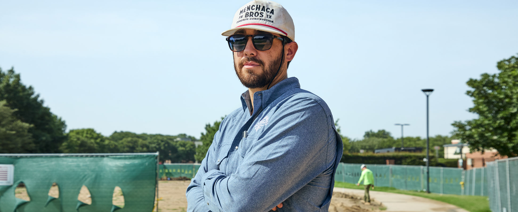 A man, Nathan Menchaca, in a blue button-up shirt.
